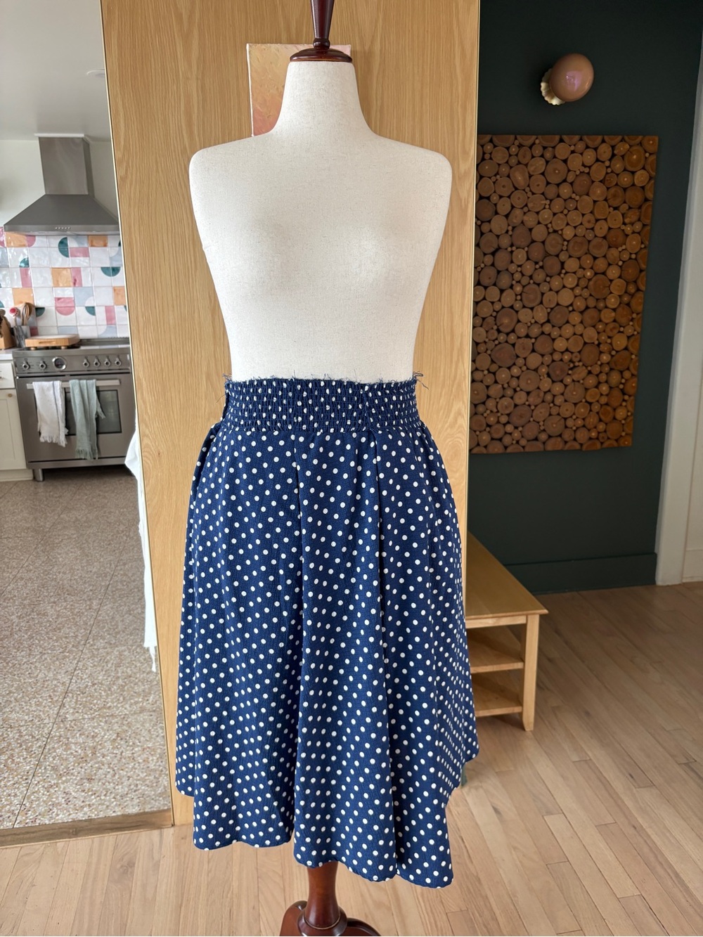 Navy Polka Dot Smocked Waist Midi Skirt